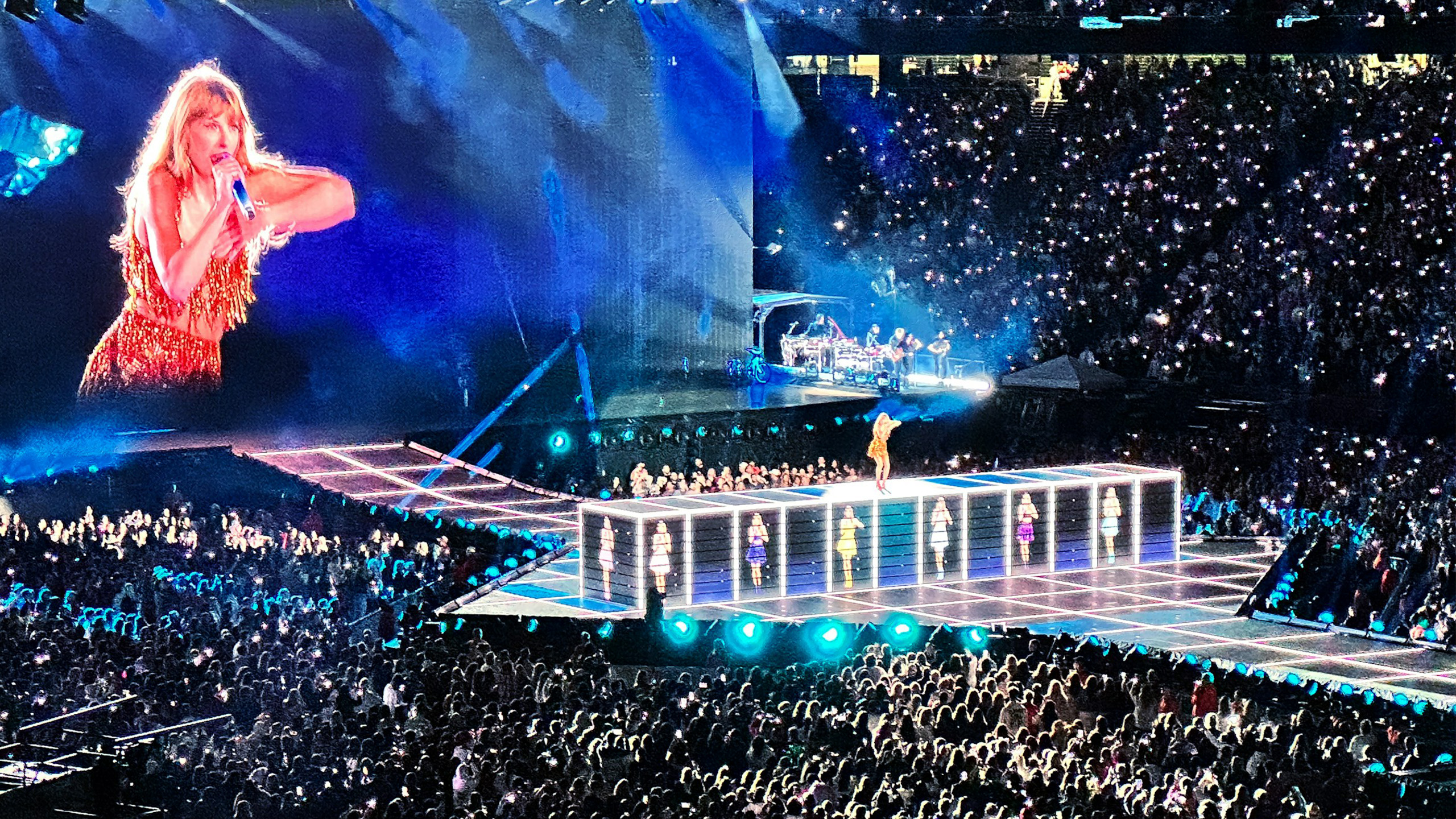 taylor swift by stephan mease unspash Taylor Swift performing in a stadium